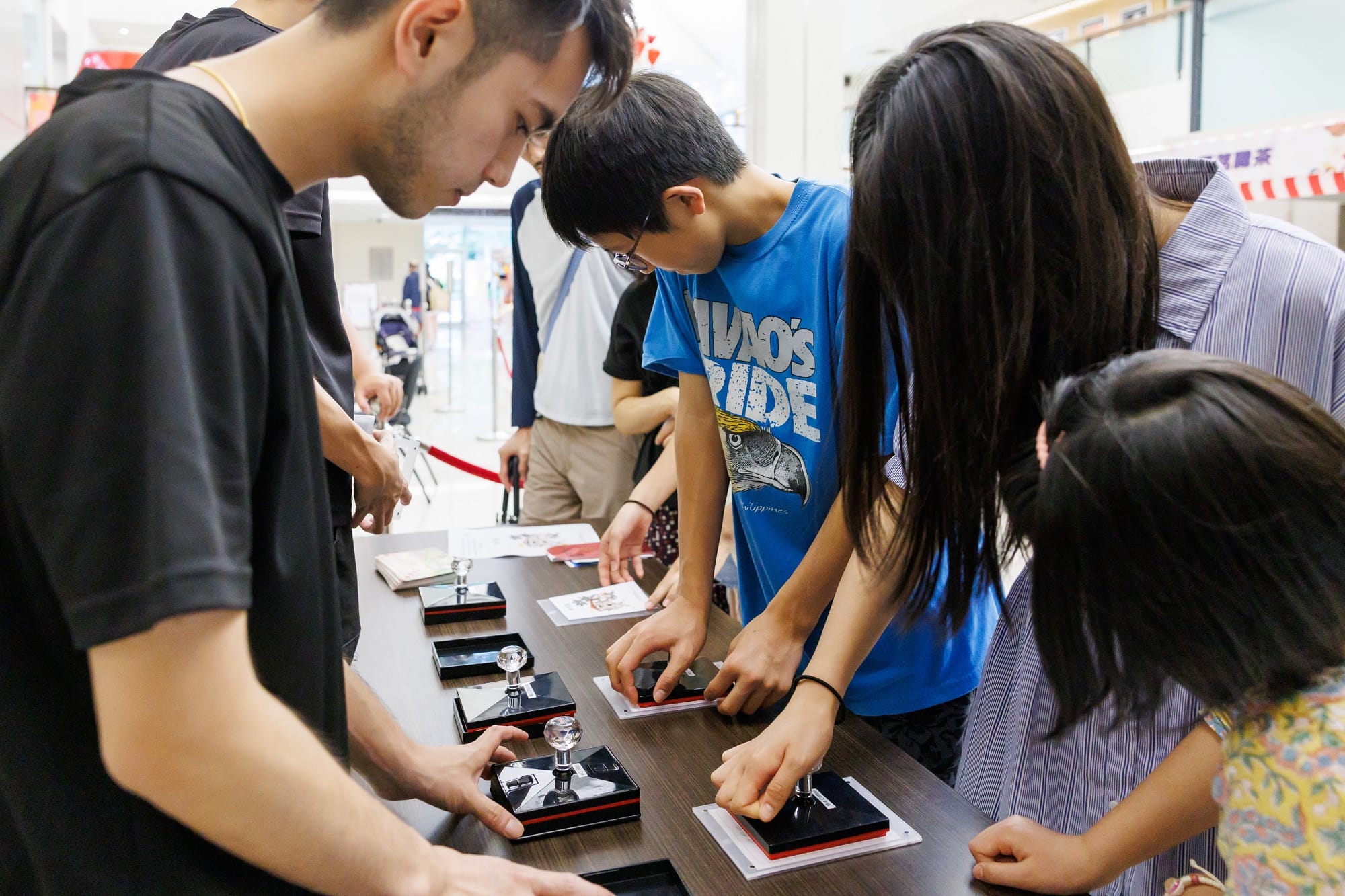 public stamping on paper at xiao qing stamp rally